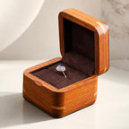 AtelierRings Windsor ring box made of solid African Rosewood with a soft brown suede interior holding a diamond ring.